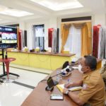 Gubernur Rusli saat mengikuti Rapat Paripurna DPRD ke-58 dalam rangka pembicaraan tingkat I terhadap Rancangan Peraturan Daerah Tentang Perubahan APBD Provinsi Gorontalo Tahun Anggaran 2021 secara virtual, Senin (16/8/2021). Dalam Rapat paripurna istimewa ini tujuh fraksi PRD Provinsi Gorontalo menyetujui Rancangan Peraturan Daerah (Ranperda) tentang Perubahan APBD Provinsi Gorontalo Tahun Anggaran 2021