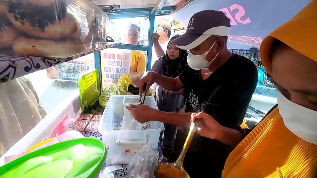 Pedagang Kue Lopes
